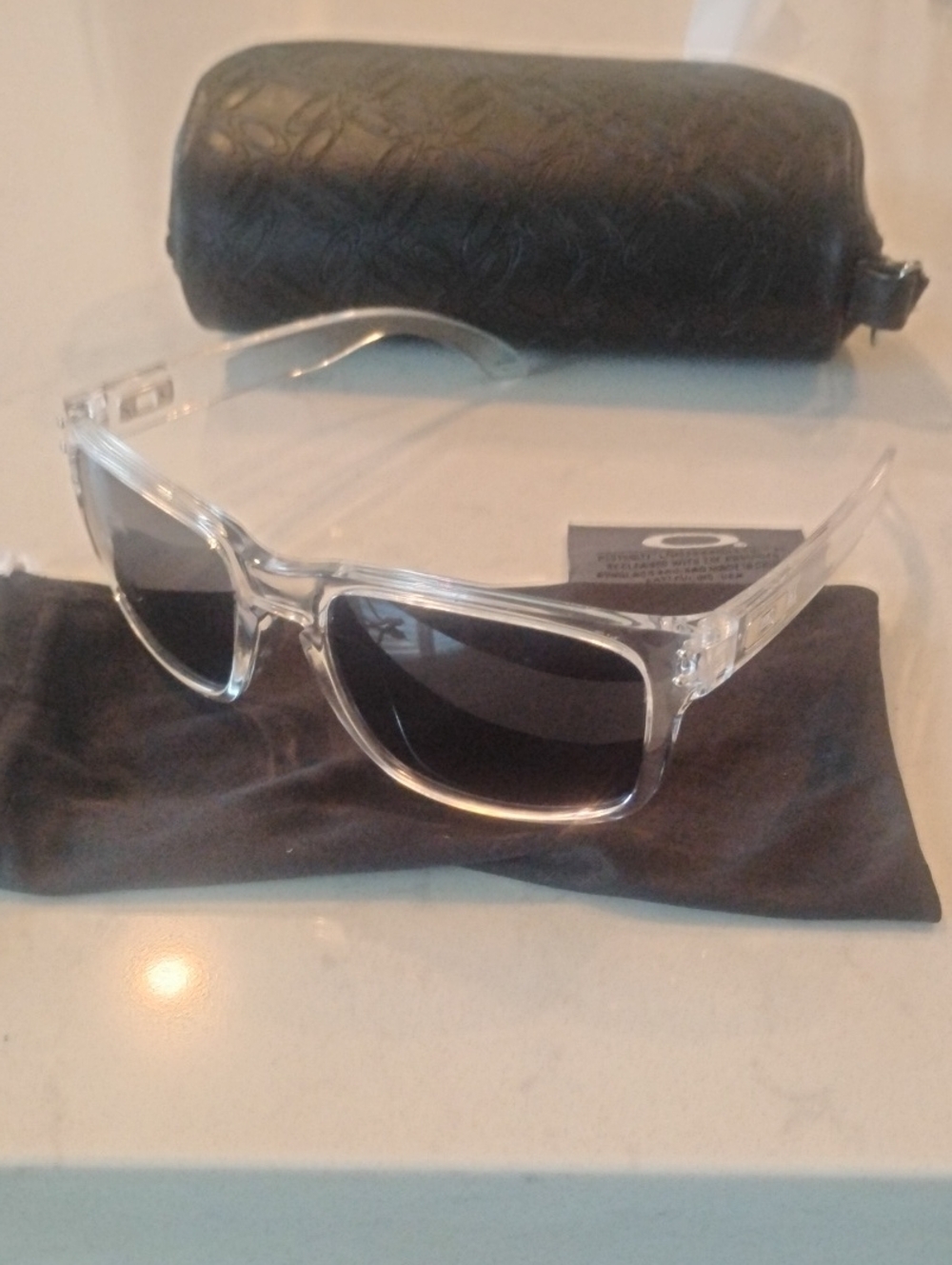 Oakley Clear Frame Sunglasses with Dark Lenses